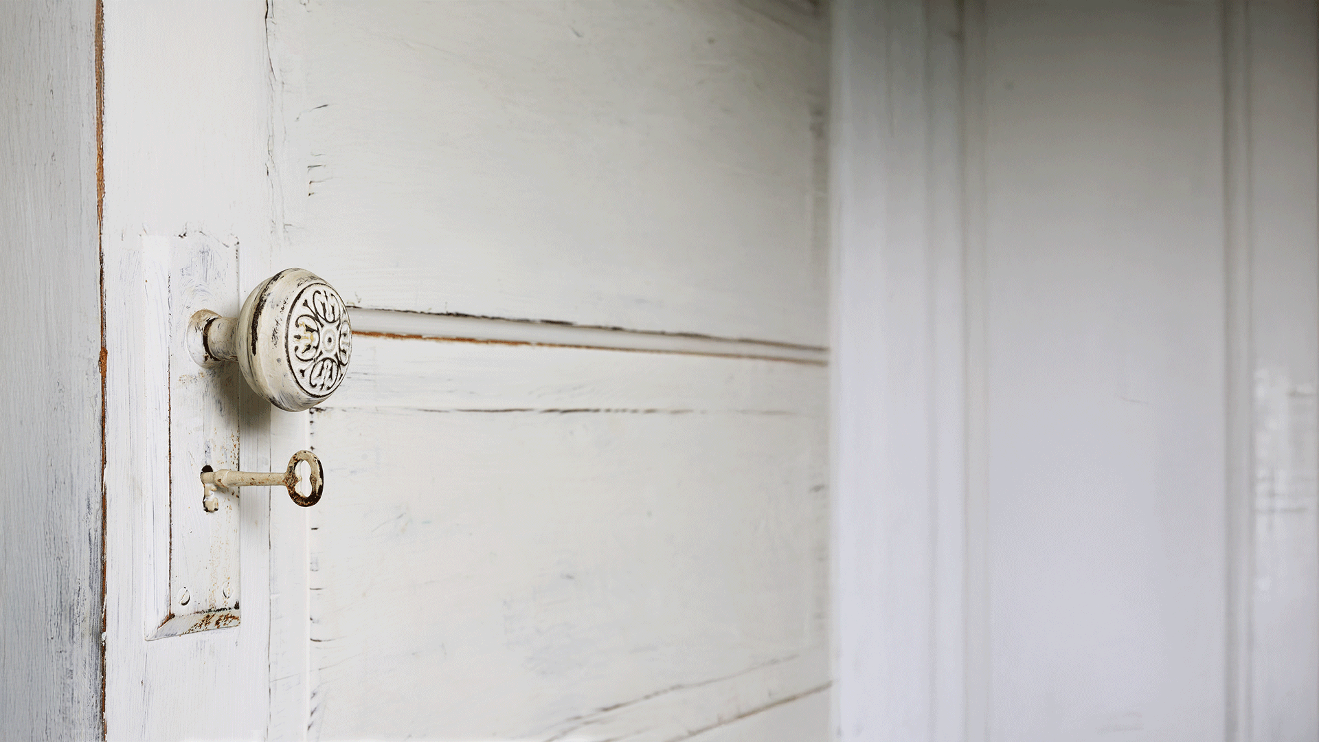 White door with skeleton key